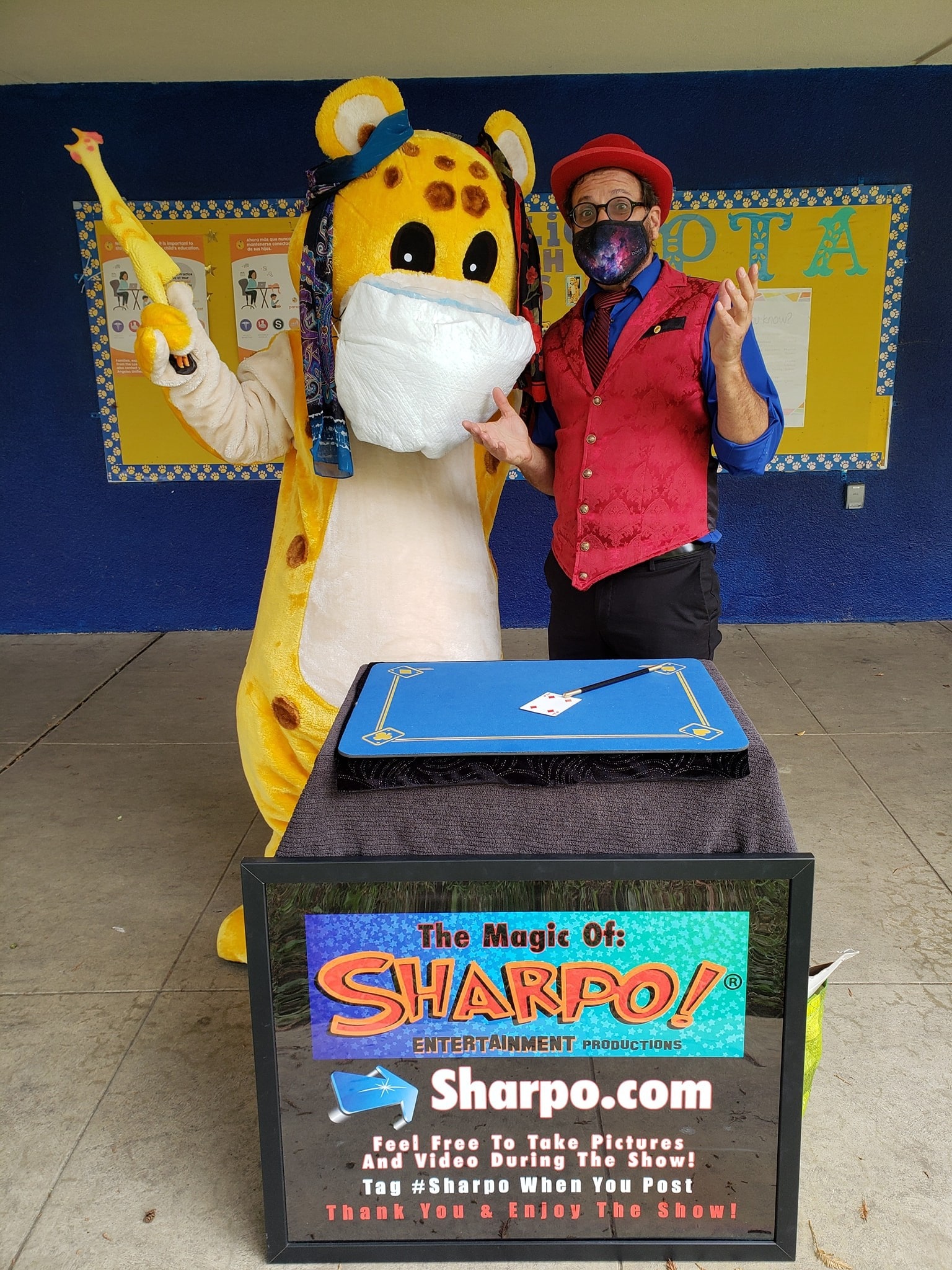 Sharpo!® entertaining magic for kids!  Posing here with a school mascot.